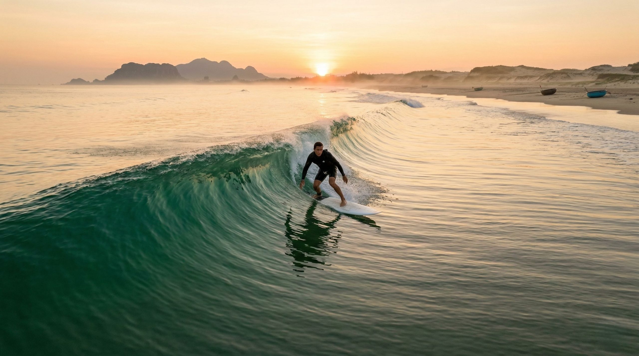 The scene at sunrise was serene, the water's surface shimmering like a mirror. The waves didn't break into fragments but rolled into long streaks.